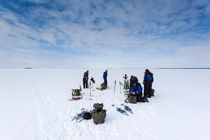 Arctic Day with Ice Fishing and Floating - Snowshoeing through the Finnish forest