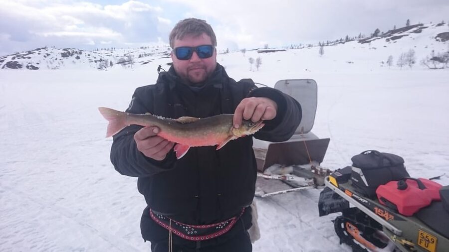 Day with a local - a true finnish experience - Making your own ice-fishing hole