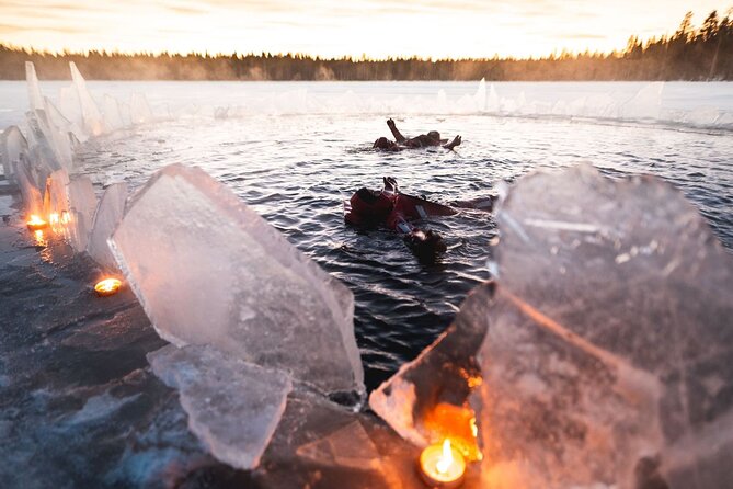 Daytime Arctic Ice-Floating in Rovaniemi, Small-Group - Entering the Icy Lake in a Buoyant Suit