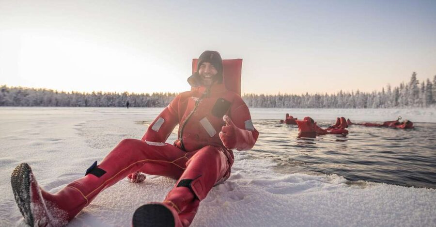 Daytime Ice Floating Rovaniemi, Frozen Lake Experience - Stepping into the icy water