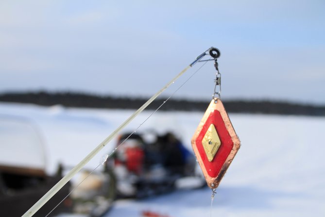 From Ivalo: Ice Fishing Safari to Lake Inari, reindeers & lunch - Meeting the reindeer on an island