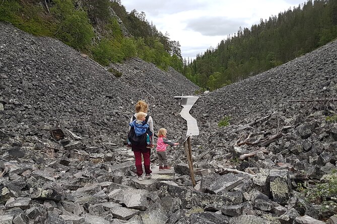 Guided easy hike in Finland deepest gorge in Pyhä-Luosto National Park - Holy Baptism Waterfall is the route’s payoff