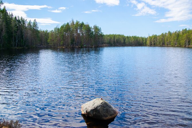 Helsinki: Nuuksio National park hiking with campfire lunch - Meeting the blue Wild Frame Adventures minivan