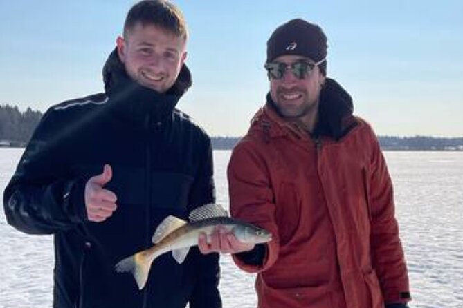 Ice fishing experience with Backpacker Helsinki Tour - Sausages, glögi, and piparri by the fire