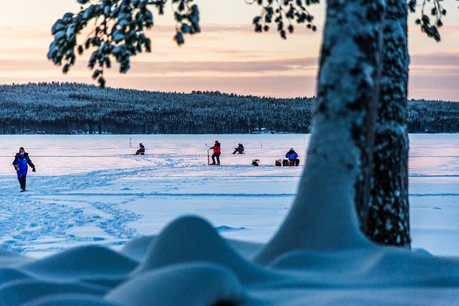 Ice Fishing Trip in Rovaniemi - Getting onto the ice and drilling the first hole