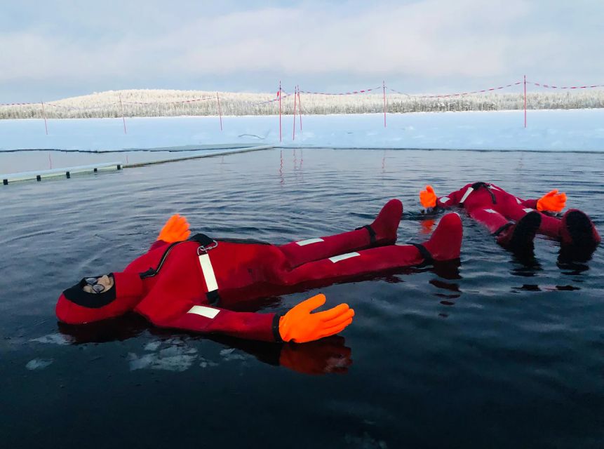 Lapland: Ice Fishing, Floating & BBQ Snow Adventure - Floating in a frozen lake