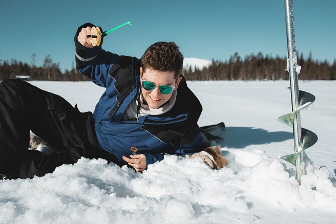 Lappish Lunch Break -Snowmobiling, ice fishing and tasty food - Who will enjoy this Rovaniemi snowmobile tour