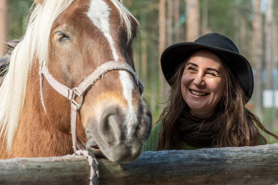 Levi: Evening Horseback Ride with Northern Lights - Riding Finnish horses through the evening forest