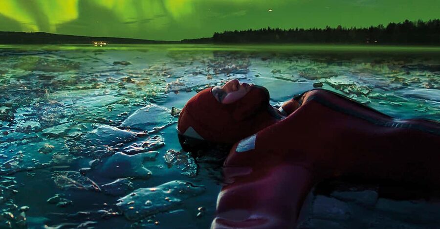 Levi: Ice Floating and Northern Lights Tour - Getting ready in the special rescue suit