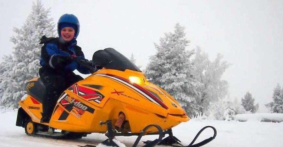 Levi: Lapland Family Snowmobile Safari - The main ride through forests and across the lake