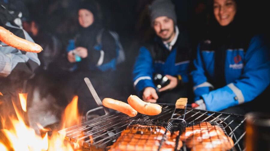 Levi: Northern Lights Snowmobile Tour with Snacks and Drinks - Getting dressed for three hours in the Arctic night
