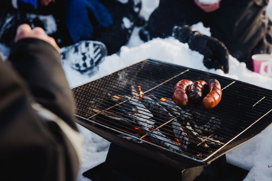 Rovaniemi: Arctic Circle Ice Fishing Experience - The Campfire, Hot Juice, and Sausages