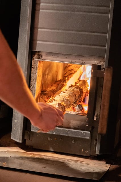 Rovaniemi: Private Sauna and Ice Swimming Tour with Snacks - Taking the ice plunge