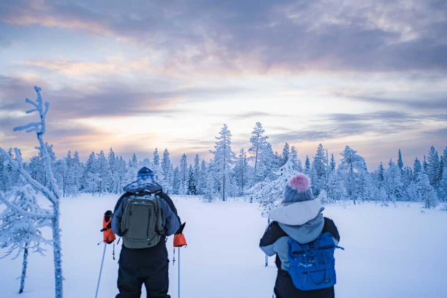 Rovaniemi: Snowshoe Wilderness Adventure - Getting fitted with snowshoes and poles