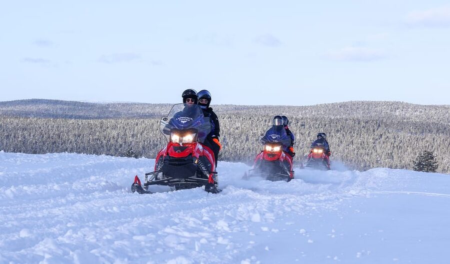 Saariselkä: Ice Fishing Safari by Snowmobile - Snowmobiling through forests and open fells