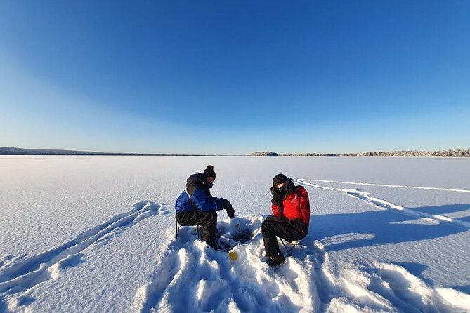 Snowmobile and Ice Fishing Experience - Drilling through nearly a meter of ice