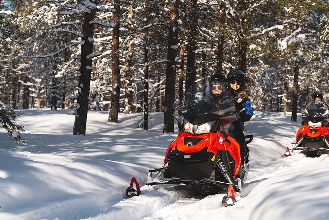 Snowmobile Safari into the Arctic Circle Forest - Learning the controls before the forest ride