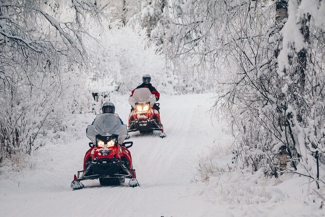 Snowmobile Safari into the Wilderness, Apukka Resort Rovaniemi - Following the snowy trails outside the resort
