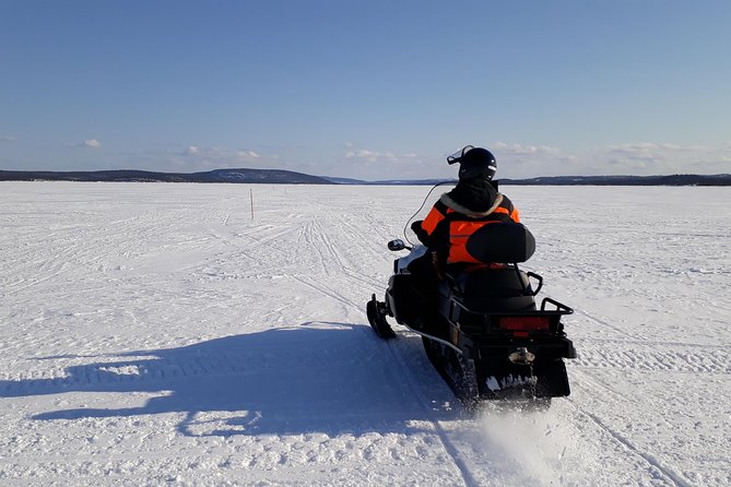 Snowmobile Safari to Lake Inari, meet & feed Reindeers, Lunch - Riding across Lake Inari