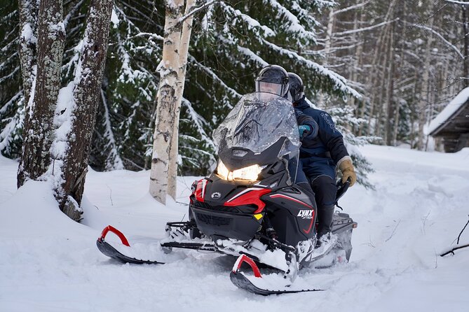 Snowmobile Safari to the Wilderness - Snowmobiling through forests and frozen rivers