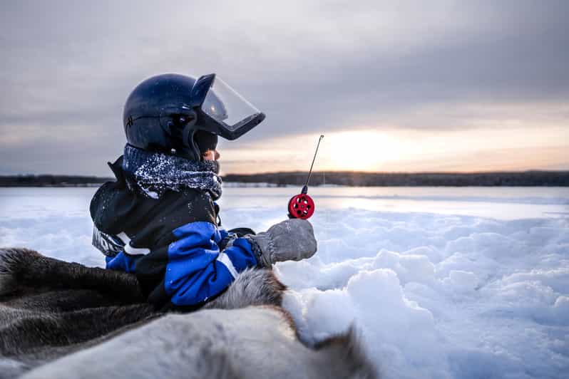 Snowmobile Safari with Ice Fishing Experience - Drilling a hole and learning to fish on ice