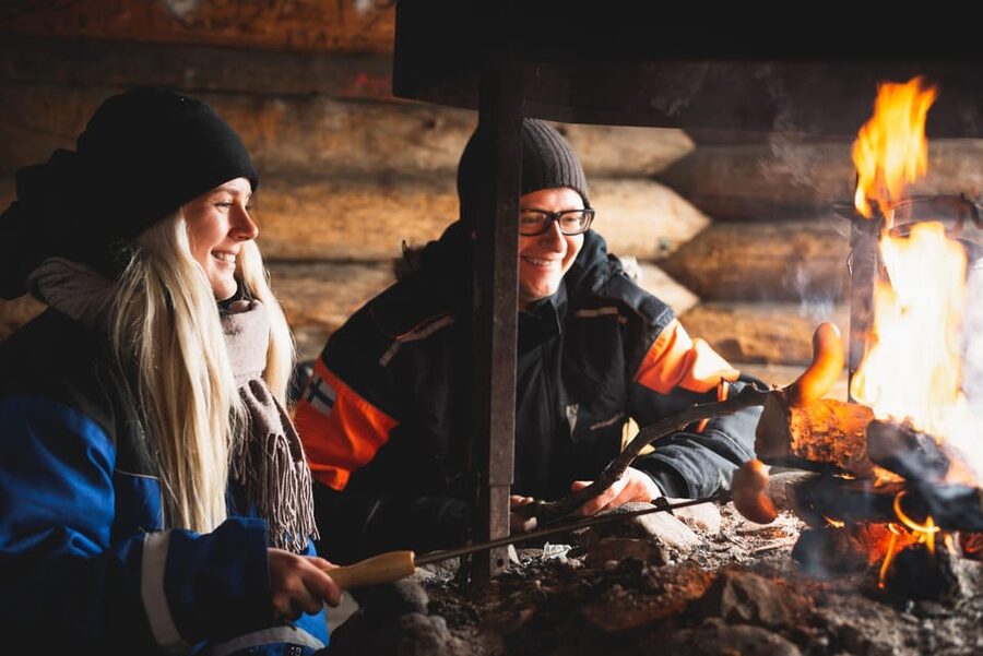 Snowmobile Safari with Ice Fishing Experience - Reindeer burgers beside the open fire