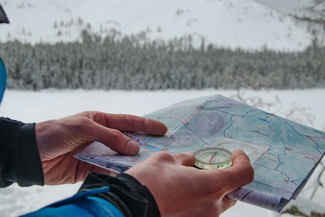 Snowshoeing Adventure with Ice-Fishing, Fire and Survival - Map and compass work on the way to the lake