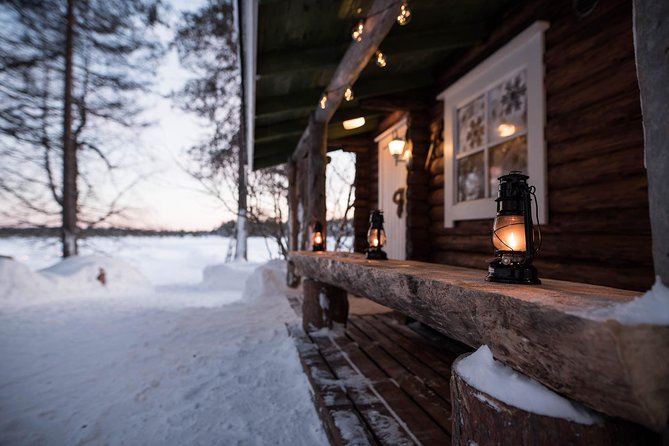 Traditional Lappish evening in the wilderness with dinner - Eating Smoked Salmon Beside an Open Fire